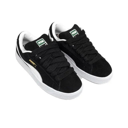 Puma Suede XL sneakers, black suede with green tongue label and white laces