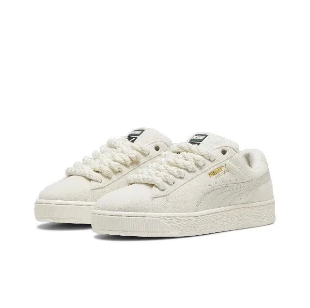 Puma suede sneakers in light beige, pair shown with lace-up front and white midsole
