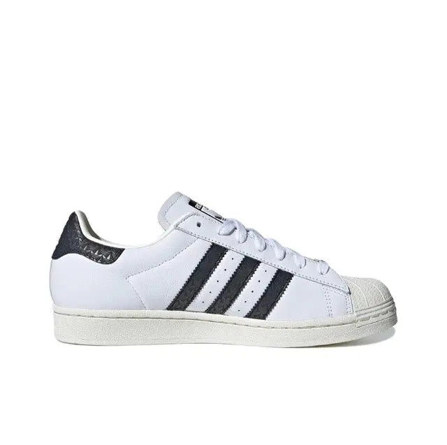 Adidas Superstar sneakers in white leather with black triple stripes and lace-up front