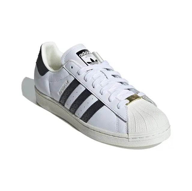 Adidas Superstar sneakers, white leather with black stripes and gold heel detail
