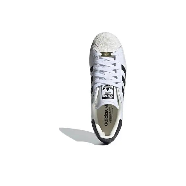 Adidas Superstar sneakers, white upper with black heel panel and lace-up closure
