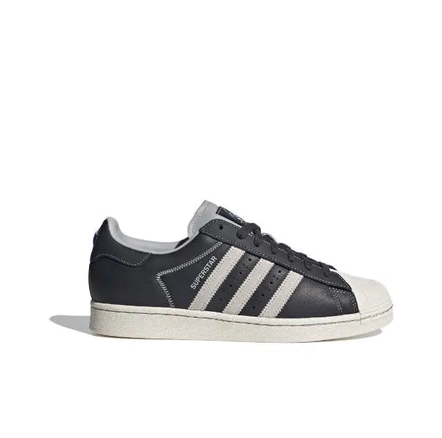 Adidas Superstar low-top sneakers, dark carbon upper with white triple stripes