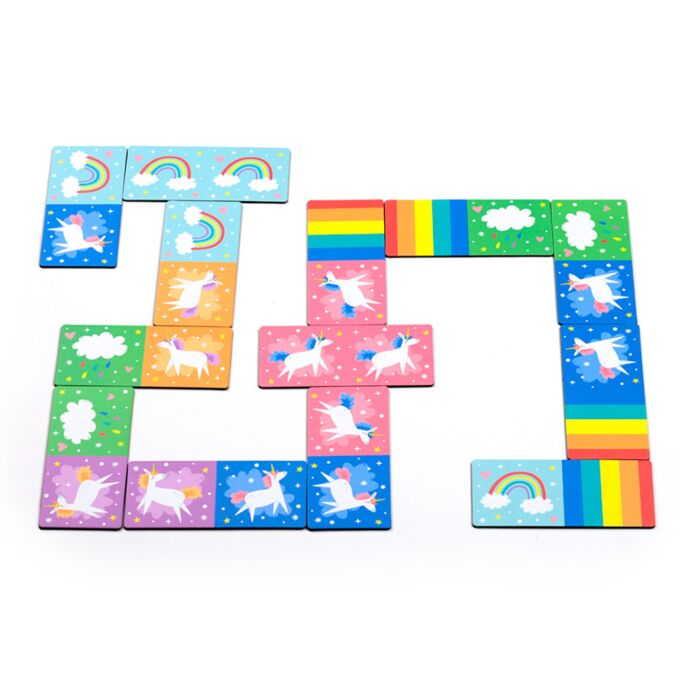 unicorn magic kids dominoes game being played with colourful tiles on a table