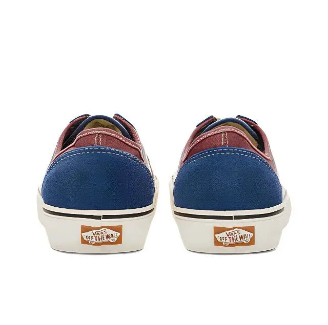 Low-top sneakers heel view with maroon lining, navy canvas backs, and white midsole