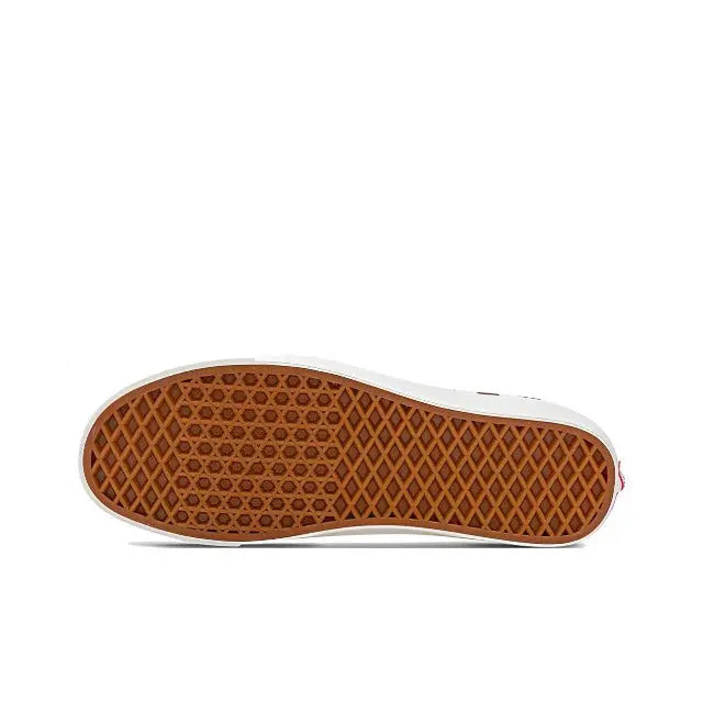 Textured rubber outsole with traction tread on the white cupsole edge
