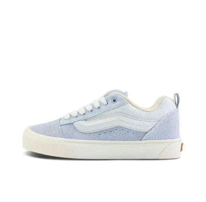 Knu Skool low-top sneaker in light blue and off-white, side view with lace-up