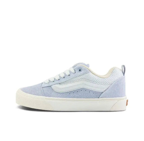 Knu Skool low-top sneaker in light blue and off-white, side view with lace-up