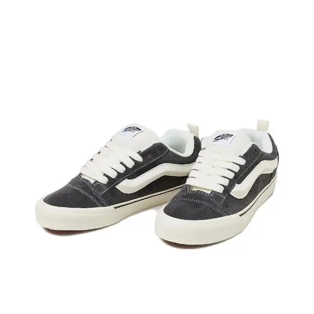 Vans Knu Skool low-top sneakers, pair view; dark upper with white laces and side stripe