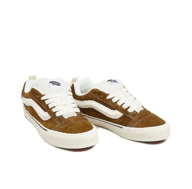 Brown and white Knu Skool low-top sneakers, front-and-side view