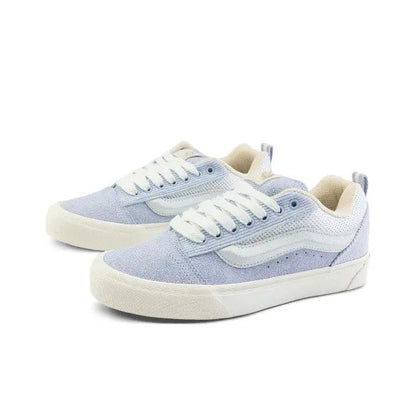 Knu Skool low-top sneaker, front 3/4 view, light blue uppers and cream sole