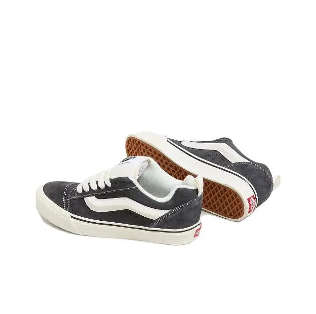 Vans Knu Skool sneakers, heel and outsole view; dark upper with white trim