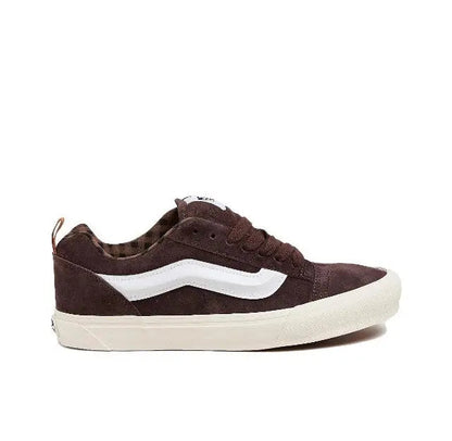 Brown low-top lace-up sneakers with white side stripe and rubber sole