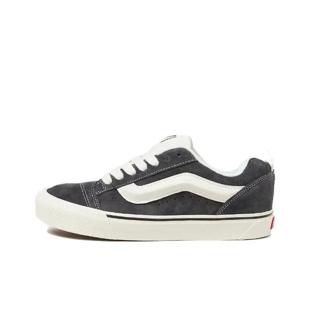 Vans Knu Skool low-top sneakers; dark suede upper, white lace panel, white sole