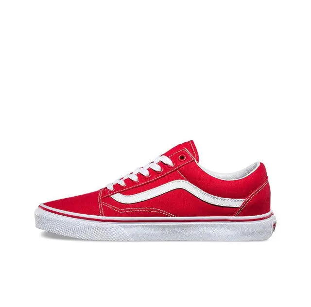 Red and white low-top lace-up sneakers with white side stripe and rubber sole