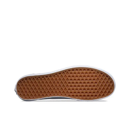 Brown rubber outsole with diamond tread and white sidewall edge on low-top sneaker