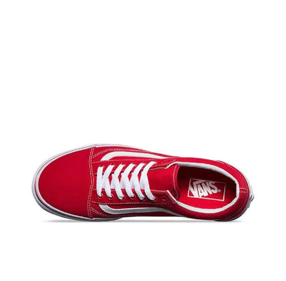 Red low-top sneakers with white laces, white side stripe, and Vans logo on tongue