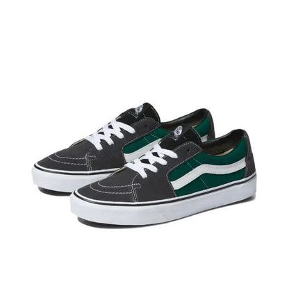 Pair of low-top skate shoes in black with green-and-white stripes and white laces