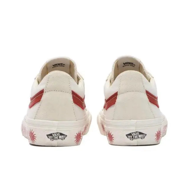Vans SK8-Low heel view pair: white uppers with red stripe and logo print
