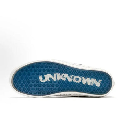 Vans Slip-On outsole, blue tread with white 'UNKNOWN' lettering and gray edge