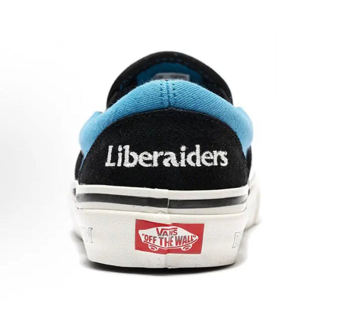 Vans Slip-On sneakers, black heel with blue collar and white sidewall, back logo tab
