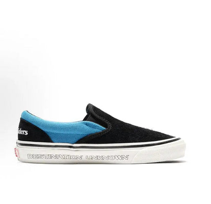 Vans Slip-On sneakers, blue heel panel with black upper and white 'Destination Unknown' sole