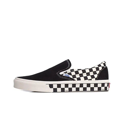Vans slip-on sneaker in black canvas with checkerboard side stripe and white rubber sole
