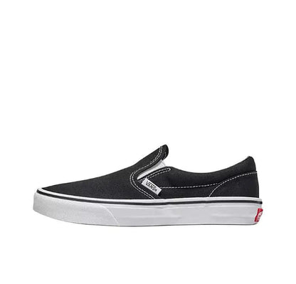 Vans Slip On black canvas sneakers with elastic gore and padded collar, side view.