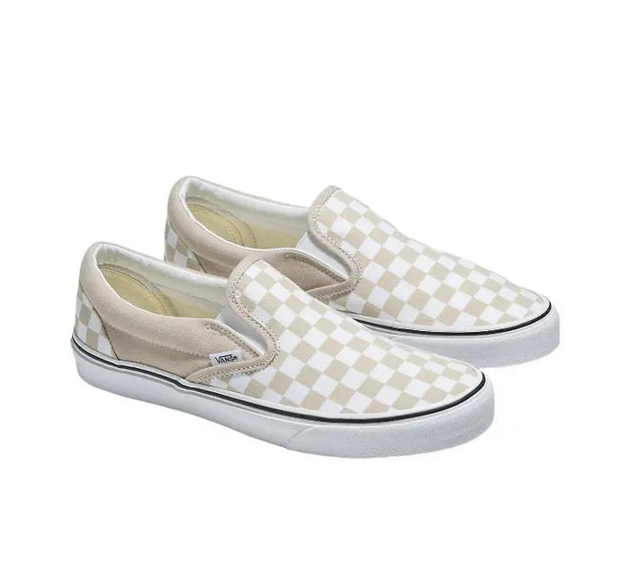 Vans Slip-On shoe pair in beige/white checker canvas with elastic gore, white rubber sole.