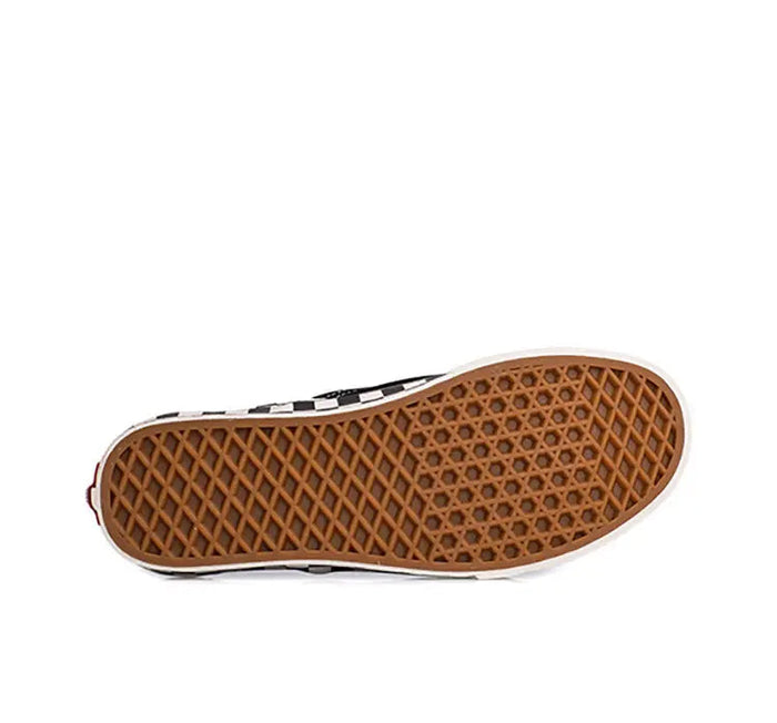 Vans slip-on outsole with tan rubber tread and white sidewall