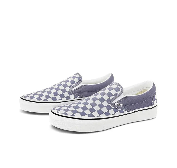 Vans slip-on sneaker pair, blue-gray checkered canvas and white rubber sole