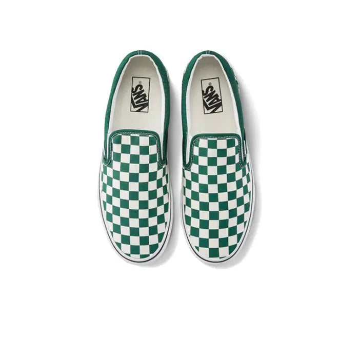 Pair of slip-on sneakers with green-and-white checkerboard uppers and Vans logo tags