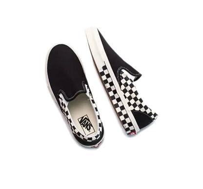 Vans slip-on pair, black uppers with checkered panel and white logo patch