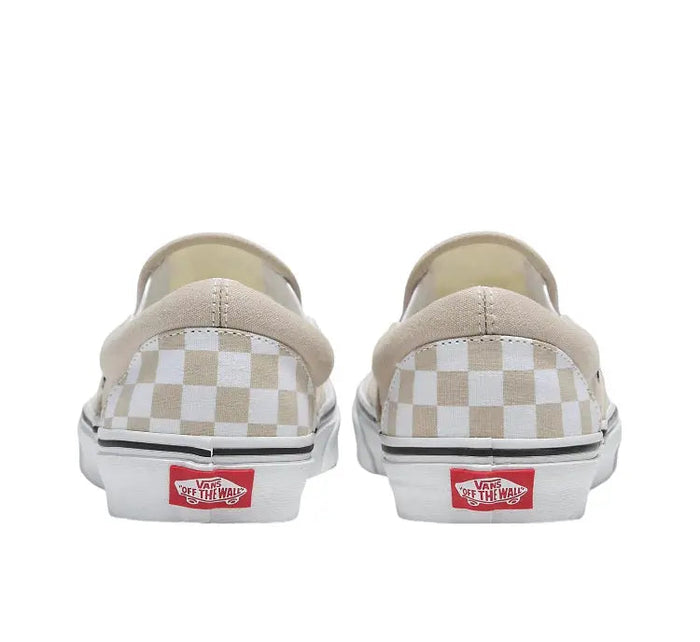 Vans Slip-On heel view with beige canvas, white checker panel, red Vans logo patch.