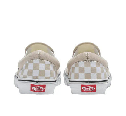 Vans Slip-On heel view with beige canvas, white checker panel, red Vans logo patch.