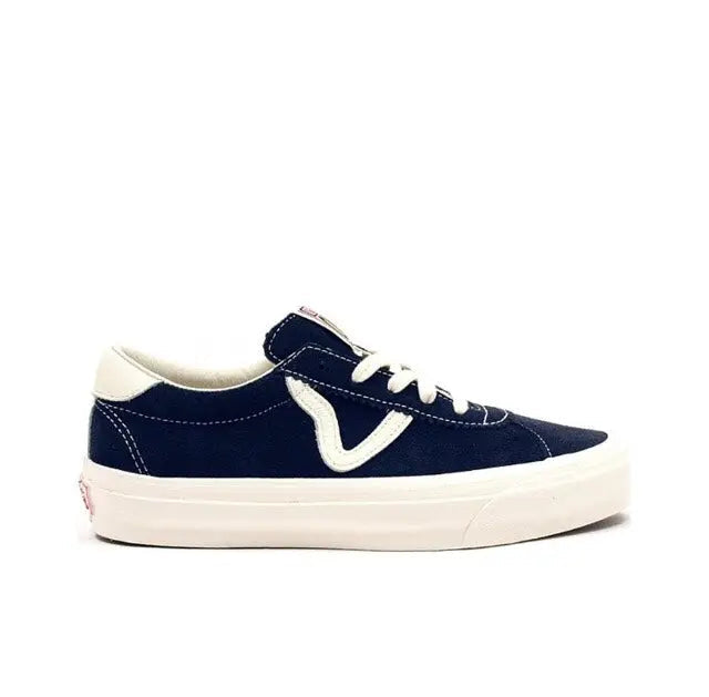 Navy and off-white low-top sneakers with white V logo and cream rubber sole