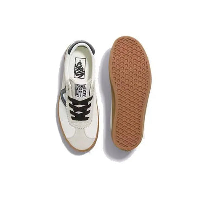 Vans sneaker pair showing outsole; beige/white uppers with gum tread and black laces