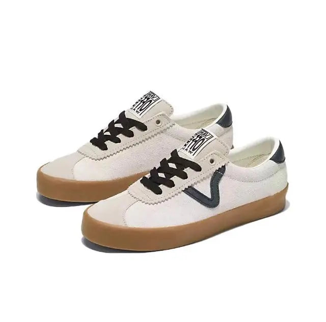 Vans low-top sneakers side view, beige/white canvas, navy stripe, gum rubber sole