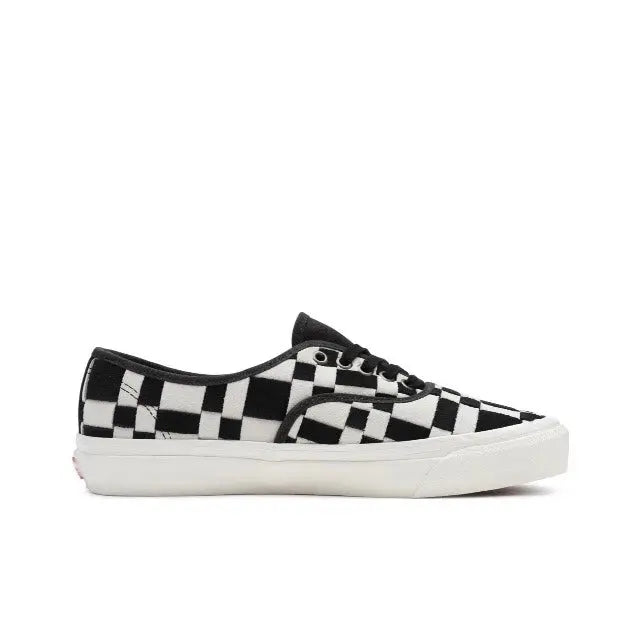 Vans checkerboard sneakers in white and black with white rubber sole