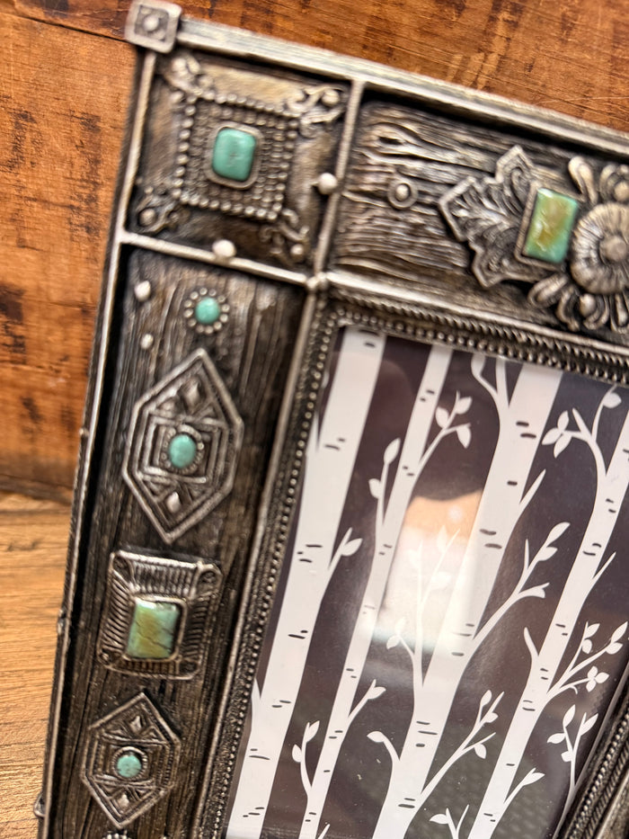 Weathered silver picture frame with turquoise stone insets, ornate border detail