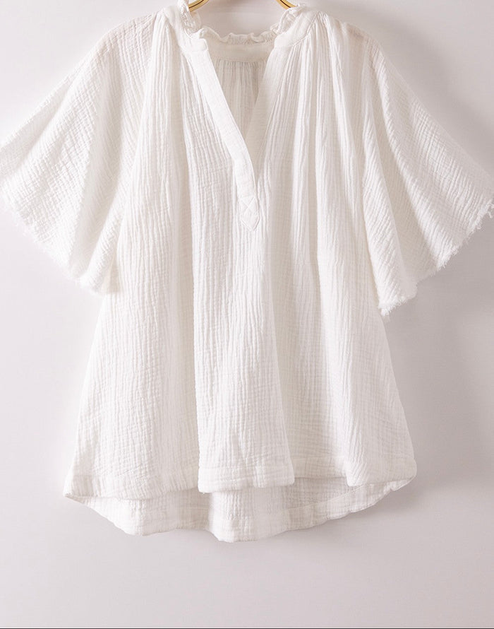 White cotton mineral-washed shirt with short sleeves and button placket