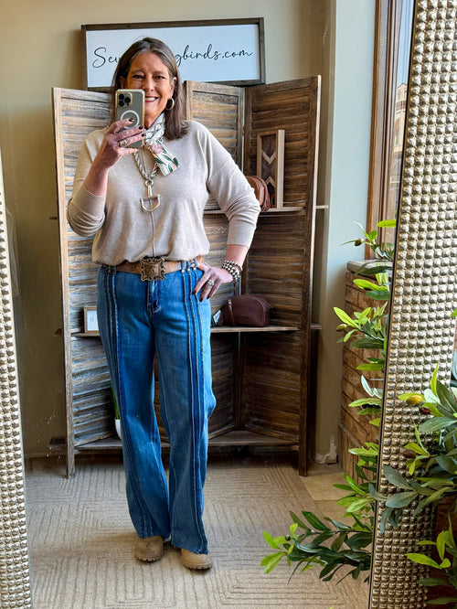 Dark blue wide-leg seamed jeans with belt loops and front seam stripes