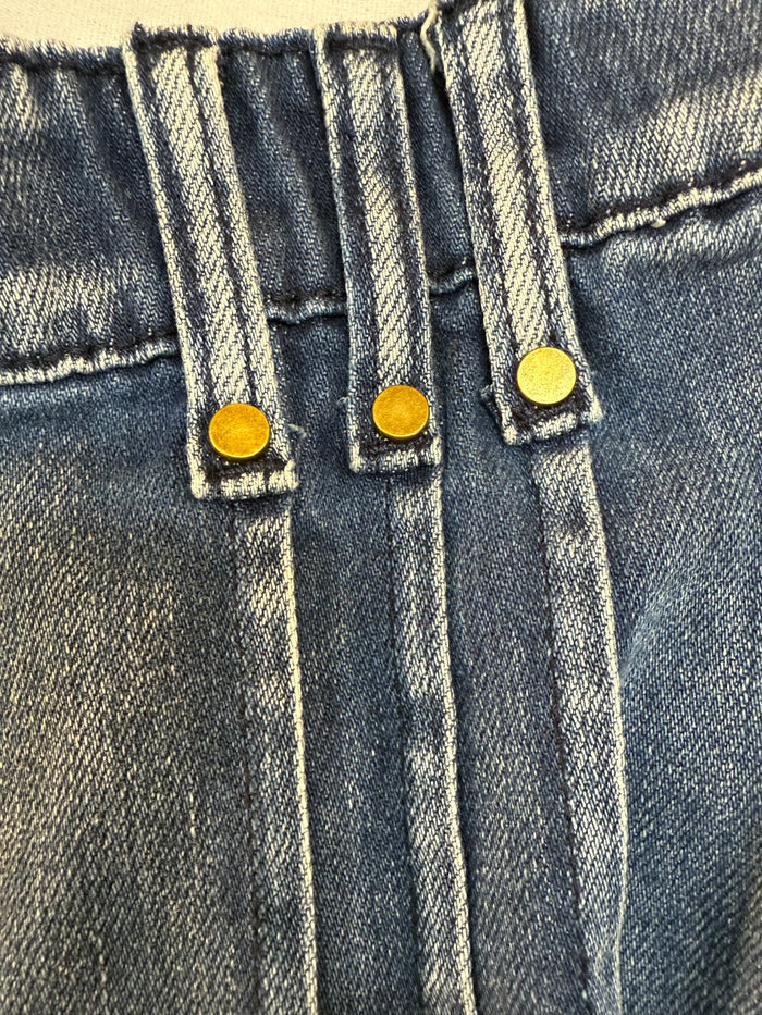 Wide-leg jeans with contrast front seam lines and gold button closures