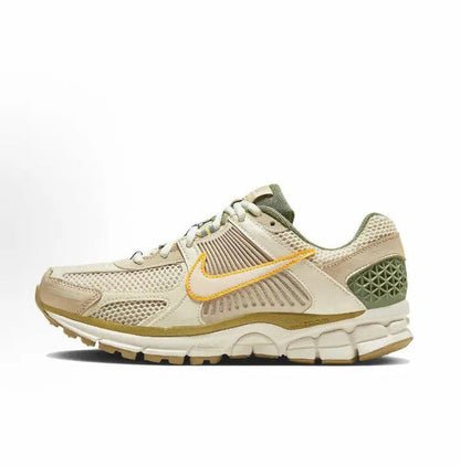 Nike Zoom Vomero 5 SP low-top sneakers in pale ivory with orange and green accents