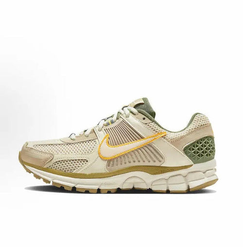 Nike Zoom Vomero 5 SP low-top sneakers in pale ivory with orange and green accents