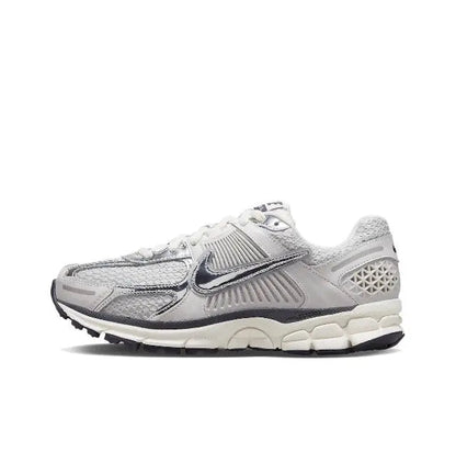 Light gray running shoe with Nike swoosh, mesh panels, lace-up closure