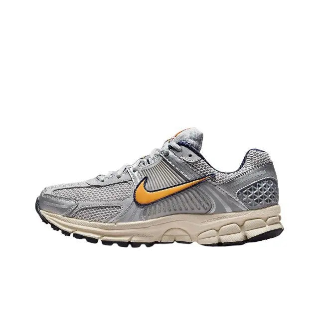 Nike Zoom Vomero 5 SP running shoe, light gray with orange swoosh and off-white sole
