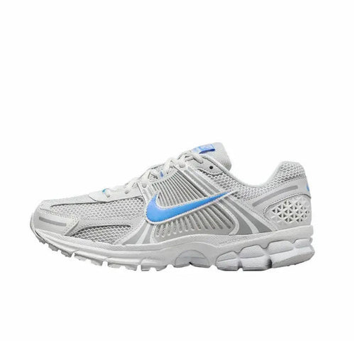 Running shoes in white with blue swoosh, mesh upper, lace-up design, gray overlays