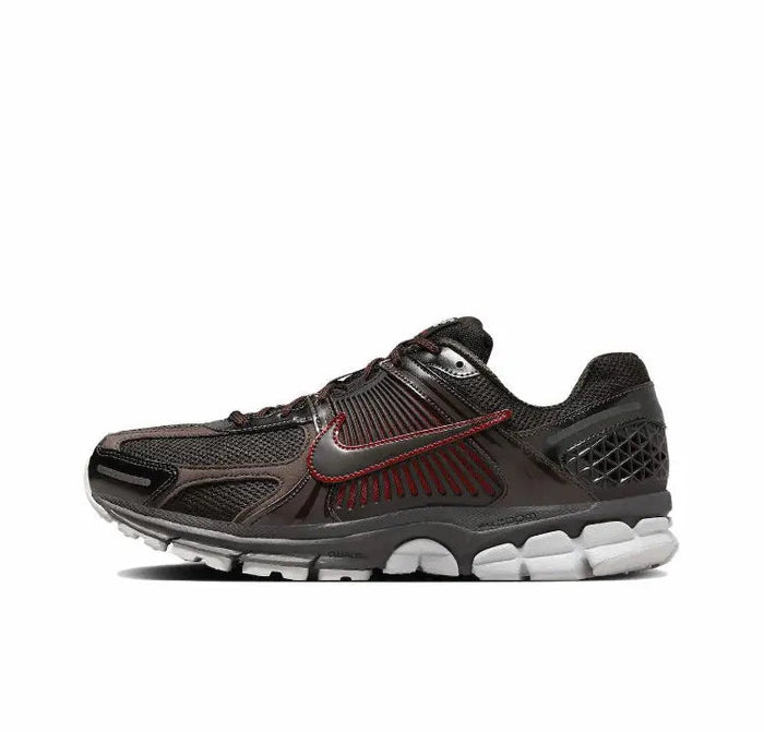 Nike Zoom Vomero 5 SP running shoe with dark upper and red swoosh, side view