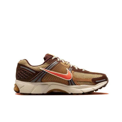 Running sneakers side view, brown upper with orange swoosh and white midsole