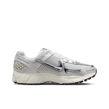 Light gray running shoe side view with Nike swoosh, textured midsole, lace-up